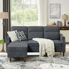 a living room scene with focus on the sectional sofa