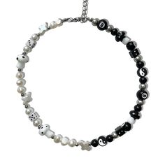 The 'YIN & YANG' half black, half white freshwater pearl necklace is what you've been waiting for - perfect for those who are looking to dress up any outfit with jewelry! No matter how this necklace is styled, the 'YIN & YANG' will get heads turning, guaranteed.  Made with lamp work glass charms and acrylic charms, freshwater pearls.  Waterproof and rust-free.  Available in lengths 14", 15", 16", 18", 20".  Model is wearing 15".  Handmade in Los Angeles. Adjustable Black Pearl Necklace, Adjustable Black Beaded Necklace With Pearl Chain, Adjustable Black Beaded Pearl Necklace, Black Beaded Pearl Necklaces With Pearl Charm, Black Pearl Necklaces With Pearl Charm, Gift Black Beaded Necklaces With Pearl Charm, Black Beaded Necklace With Pearl Charm As Gift, Adjustable Black Pearl Necklace With Pearl Charm, Black Beaded Necklaces With Pearl Charm Gift