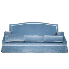 a blue couch sitting on top of a white floor