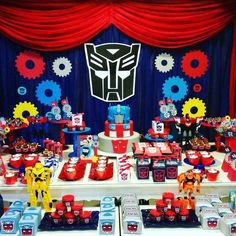 a table topped with lots of red and blue desserts