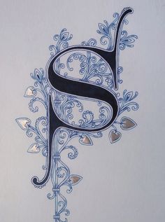 the letter s is decorated with hearts and vines on a white paper background, as well as an intricately designed monogrammed font