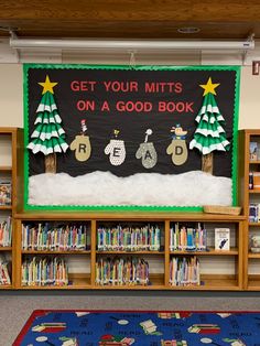 a bulletin board in a library with snow on the ground and children's bookshelves