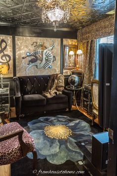 the living room is decorated in black and gold