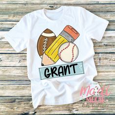 Madi Moosh Boutique: We offer 100's of designs printed on baby onesies, toddler shirts, youth tees and more. Make sure you check out our store for everything kids. This design is offered in bodysuits, short sleeve t-shirts, and 3/4 sleeve raglan shirts (baseball sleeves) 👶 We print all items using Direct To Garment printing technology. Unlike other garment decorating processes, this process allows for a super soft print that will last for years. The ink is eco and kid-friendly. 👶 Short sleeve School Sports Shirts, Custom Tank Tops, Custom Aprons, Football Boys, School Sports, Little Outfits, Custom Sweatshirts, Short Sleeve Bodysuit, School Shirts