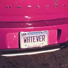 the license plate on the back of a pink car that says, whatever in it