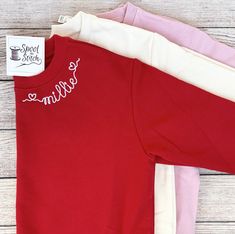 This listing is for a unisex or puff sleeve style sweatshirt with a name in the heart font embroidered along the collar.  Please use the drop down menus to choose size and sweatshirt color.  Brands:  Kids red and cream are Blanks Boutique brand Kids light pink are Rabbit Skins brand Adult red and light pink are Gildan brand Adult cream is Jerzees brand Use the personalization box to list the name to be embroidered.  Thank you for your business! Jennifer L Spool to Stitch Heart Font, Kids Light, Style Sweatshirt, Burp Cloth Set, Embroidered Sweatshirt, Kids Lighting, Personalized Embroidered, Boutique Brands, Embroidered Sweatshirts