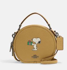 a small cross body bag with a dog on it