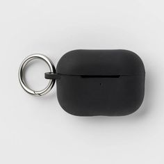 an apple airpods case is shown with a ring on the front and back side