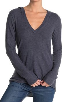 Perfect your casual style with a top cut from comfy knit fabric. Attached hood. V-neck. Long sleeves. Slips on over head. Knit construction. Approx. 27" length. Imported Winter V-neck Long Sleeve Top For Layering, Gray V-neck Top For Winter, Fall Long Sleeve V-neck Top, Casual V-neck Long Sleeve Top With Relaxed Fit, Fall V-neck Long Sleeve Top In Relaxed Fit, Fall Long Sleeve V-neck Top Relaxed Fit, Casual V-neck Long Sleeve Top For Fall, Relaxed Fit Long Sleeve V-neck Top For Fall, Relaxed Fit V-neck Top For Fall