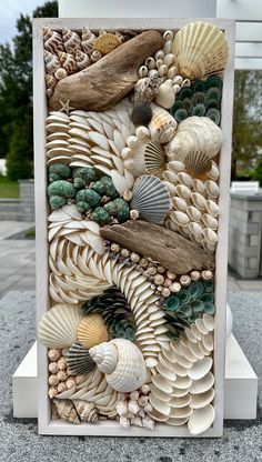 a sculpture made out of seashells and driftwood