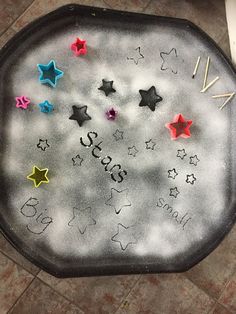 a black tray with stars and writing on it