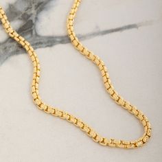 Meticulously crafted from solid 14 karat yellow gold, the 3mm Round Box Chain exudes timeless elegance and sophistication. This intricately crafted chain features a smooth design that enhances its natural luster, creating a captivating shine with every movement. Designed to be the perfect gold necklace for men, its solid and durable links promise long-lasting strength and comfortable wear for any occasion. Whether worn on its own or with a pendant, this chain's rounded design offers a refined to Luxury Jewelry With Rolo Chain, Yellow Gold Chain Necklace With Solid Link Construction, Classic Gold Plated Rolo Chain Necklace, Gold Chain Necklace With Solid Link Construction, Gold Timeless Chain Necklace With Solid Link Construction, Gold Chain Necklace With Solid Link, Timeless Style, Classic Gold-plated Rolo Chain Necklace, Luxury Tarnish Resistant Chain Necklace With Rectangular Links, Yellow Gold Necklaces With Oval Link Box Chain