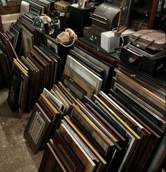 a room filled with lots of different types of furniture and items on top of each other