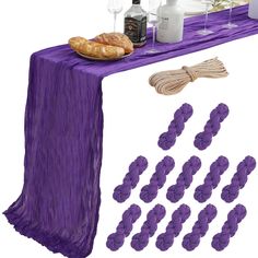 purple table cloths and napkins with wine glasses, bread, and other condiments