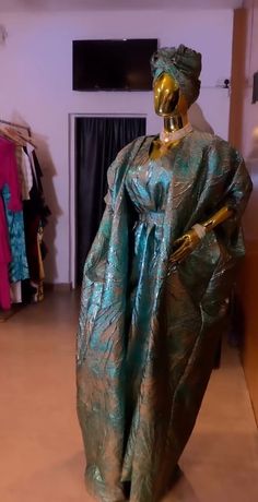 Gold Kaftan For Party With Traditional Drape, Gold Kaftan With Traditional Drape For Party, Gold Kaftan For Party And Festivals, Green Brocade Party Dresses, Brocade Dress For Eid Party, Gold Gown With Dabka For Parties, Party Gown In Brocade With Traditional Drape, Blue Festive Thobe For Party, Gold Floor-length Thobe For Party