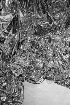 many pieces of tin foil are piled together