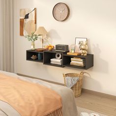 a bed room with a neatly made bed and a clock on the wall above it