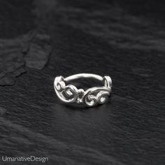 Beautiful Sterling silver nose ring for pierced nose. Tribal, ethnic, delicate design. Can be worn as an earring for the tragus, helix, earlobes & septum ring as well Material: Sterling silver 925 Wire Thickness: 0.8 mm - 20g Diameter of the ring: - 0.27Inc - 7mm *Nickel-free For other nose rings- https://www.etsy.com/shop/Umanativedesign?section_id=16881369&ref=shopsection_leftnav_6 We offer a range of septum rings, for pierced and non- pierced noses, made of different materials. You ca Helix Earrings Hoop, Unique Nose Rings, Forward Helix Earrings, Daith Earring, Sterling Silver Nose Rings, Tragus Ring, Helix Jewelry, Earring Cartilage, Piercing Tragus