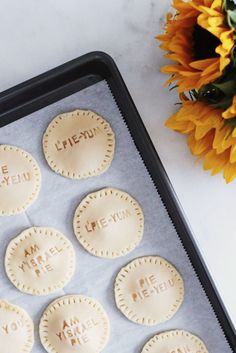 six pie crusts on a baking sheet with the words i love you, me, y'all