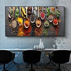 a table topped with lots of spoons filled with different types of spices and seasonings