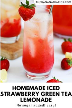 the homemade iced strawberry green tea lemonade is ready to be served with fresh strawberries