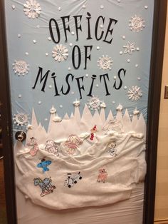 an office door decorated with snowflakes and frosting on the bottom, says office of misfits