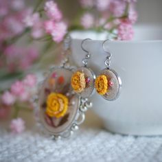 This charming vintage-inspired necklace and earring embroidered jewelry set features a delicate yellow rose embroidered on a bed of tea-dyed linen. The soft, natural fabrics and rich embroidery thread create a timeless piece that Mom will treasure. Inspired Necklace, Rose Pendant, Rose Necklace, Burgundy Floral