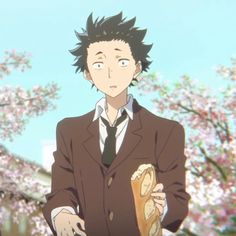 a man in a suit and tie holding a sandwich