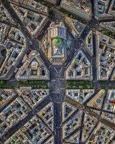 an aerial view of a city with lots of streets and buildings in the foreground