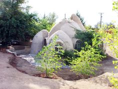 an old style house is surrounded by trees