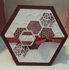 a close up of a greeting card with a bow on the front and back of it