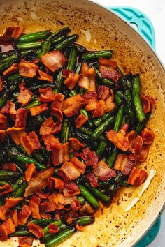 a pan filled with green beans and bacon