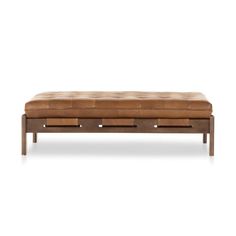 a brown leather bench with four drawers