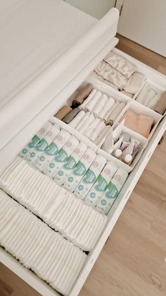 an open drawer filled with lots of white items