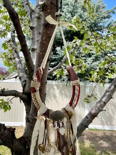 a tree that has some kind of decoration hanging from it