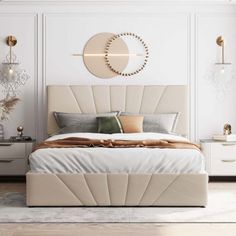 a bedroom with white walls and wooden flooring has a large bed in the middle