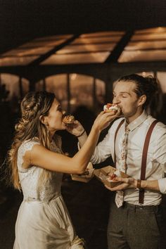 a man and woman are eating cake together