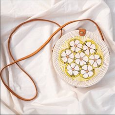 Unique Handmade Circle Flower Crossbody. -The Material Is Pure Ata Reed, Making The Material Strong And Durable. The Pieces Are All "Smoked" Over Coconut Husks As Part Of The Drying Process, Which Adds Beautiful Patina And Leave The Bag With A Slight Natural Scent That Disappears Over Time. Each Pieces Is Different From Each Other "Inside And Outside". -100% Genuine Leather Shoulder Strap. -100% Handmade -Packing: 1 Pcs White -$109 Each -Material: Ata Reed -Measurement: 7.5"W X 7.5"H X 3.5 Flower Shaped Bag With Adjustable Strap For Summer, Summer Flower-shaped Bag With Adjustable Strap, Handmade Flower-shaped Bags For Spring, Handmade Flower-shaped Spring Bags, Handmade Spring Flower-shaped Bags, White Bohemian Straw Bag For Spring, Bohemian Floral Print Bags For Vacation, Spring White Bohemian Straw Bag, White Floral Print Flower Shaped Shoulder Bag