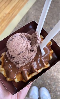 a waffle with chocolate ice cream on top