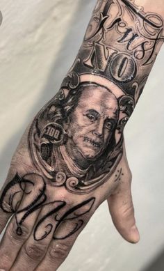 a man's hand with a tattoo on it