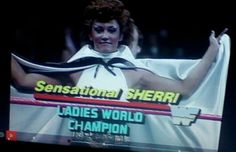 a television screen with a woman holding a scarf on it's face and the words sensation sheri ladies world champion