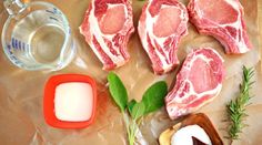 raw meat and ingredients laid out on a table