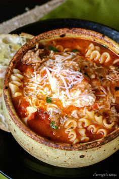 an image of a bowl of pasta soup with bread on the side and text that reads, the recipe here you got