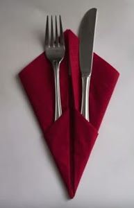 a red napkin with two forks on it