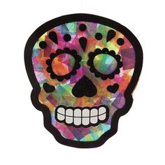 a paper cut out of a colorful skull