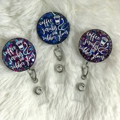 three retractable badge holders on a white furnishing with the words coffee, soda and fabulous things written on them