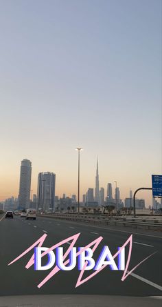 an image of the word dubai in front of a cityscape