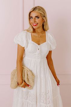 - This adorable dress is perfect for spring! - Unlined eyelet material - A built-in lining that ends above the knee - A sweetheart neckline with a tie detail - An open back with cut out detail and a crisscross back with tie closure - A waistline with an elastic back - Short puff sleeves with elastic cuffs - A flowy yet flattering silhouette that ends in an ankle length hemline Measurements S : Bust 30", Hip 34", Length 44.5", Sleeve Length 8", Waist 24-26". M : Bust 32", Hip 36", Length 45", Sle White Eyelet Fitted Mini Dress, White Eyelet Mini Length Dress, Cute White Mini Dress With Sweetheart Neckline, White Eyelet Mini Dress Feminine Style, White Mini Dress With Eyelet Details, Chic White Eyelet Mini Dress, White Broderie Anglaise Summer Mini Dress, White Eyelet Mini Dress For Day Out, White Eyelet Dress For Day Out