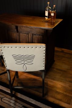 a white chair sitting on top of a wooden floor