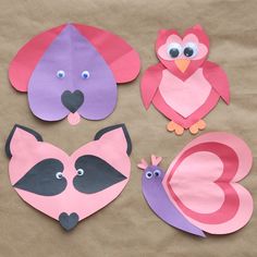 paper cut outs with animals and birds on top of brown paper bag filled with tissue bags